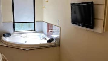 Suíte premium | 1 quarto, roupas de cama premium, frigobar, individualmente decorados