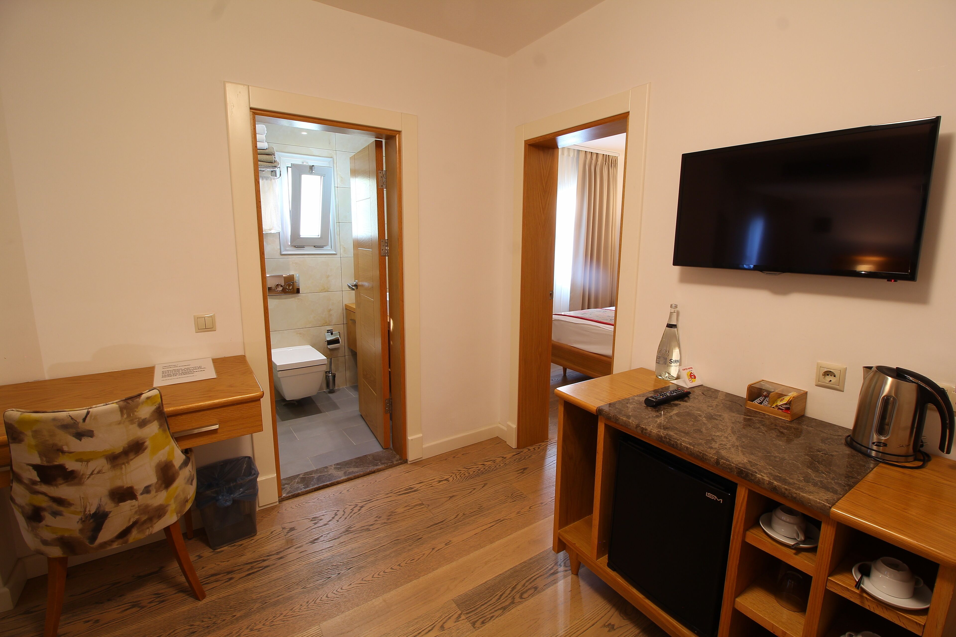 deluxe quadruple room, 1 bedroom | free minibar, in-room safe, desk, laptop workspace