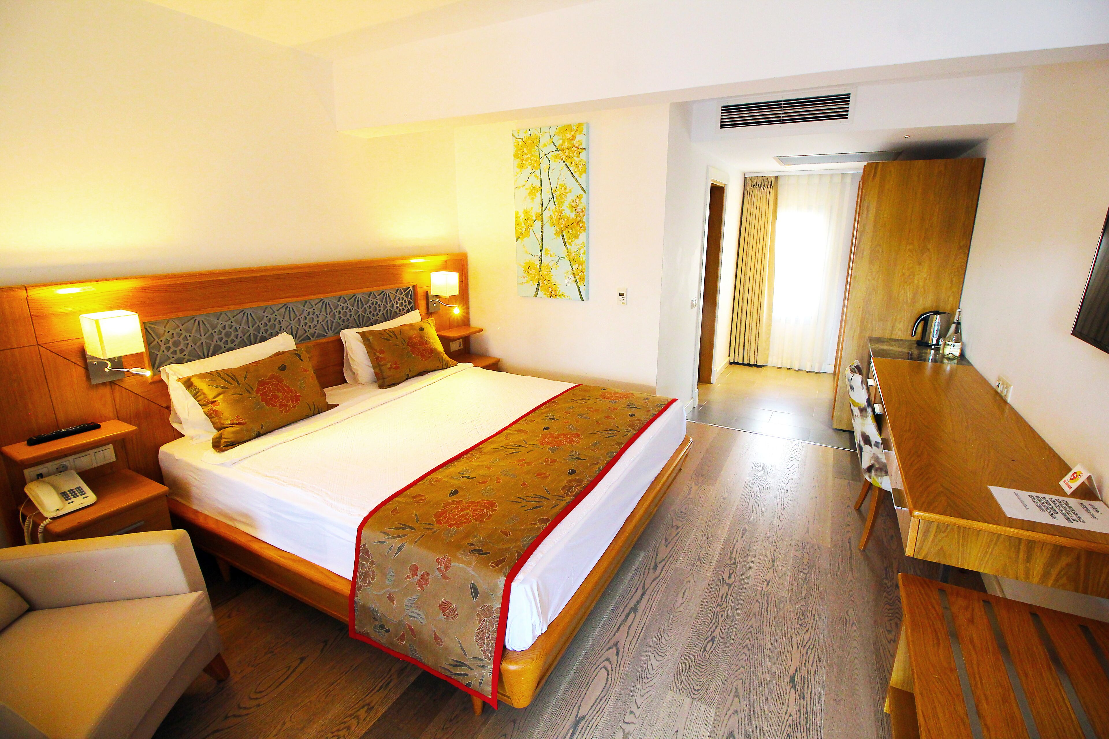 deluxe double room | free minibar, in-room safe, desk, laptop workspace