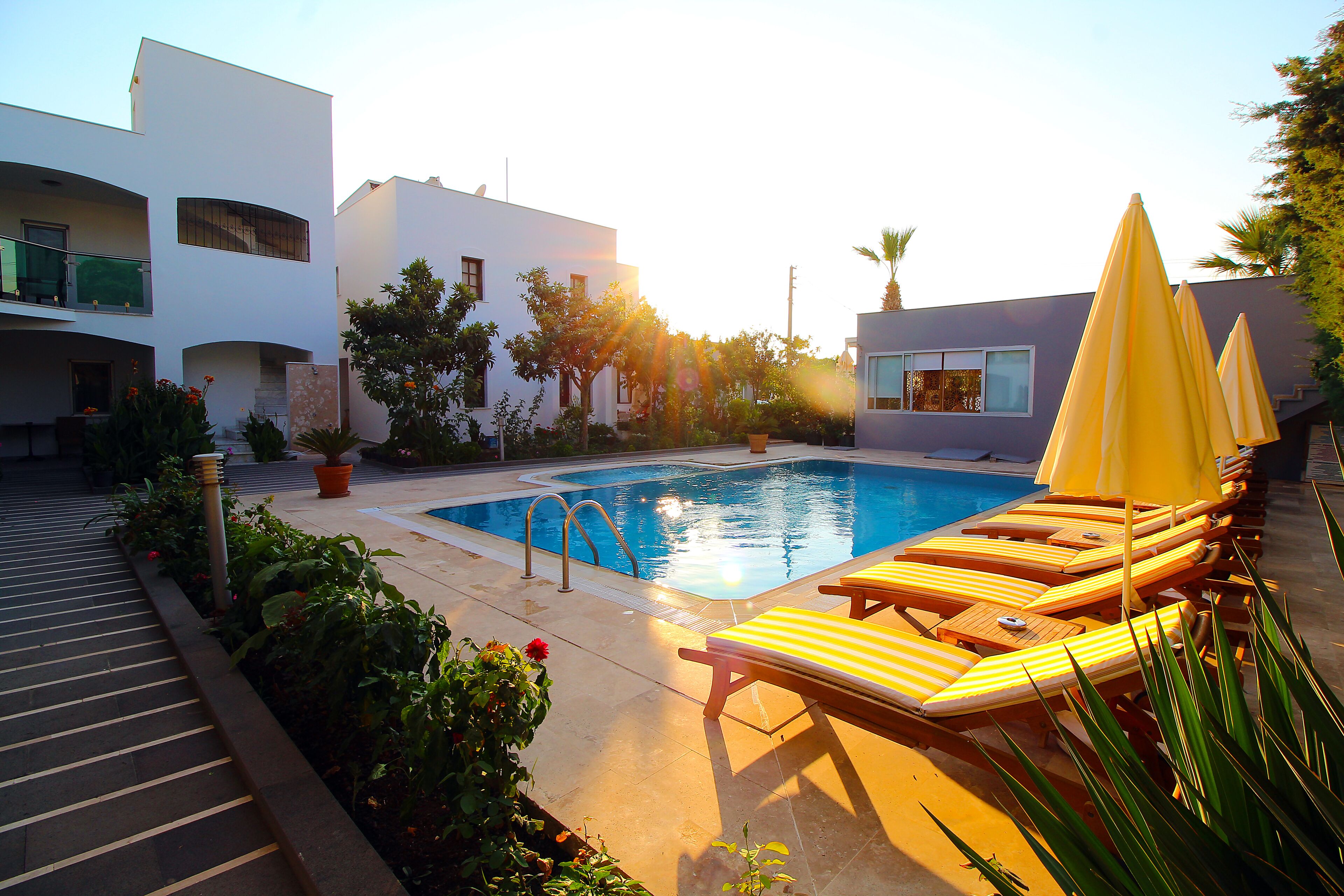 outdoor pool, pool umbrellas, pool loungers