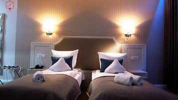 Luxe beddengoed, een minibar, een kluis op de kamer, een bureau