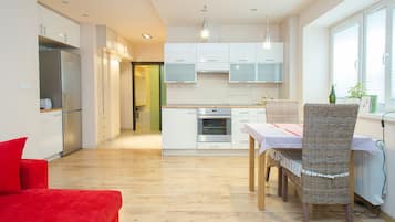 Apartamento, 1 quarto | Área de estar | TV de tela plana