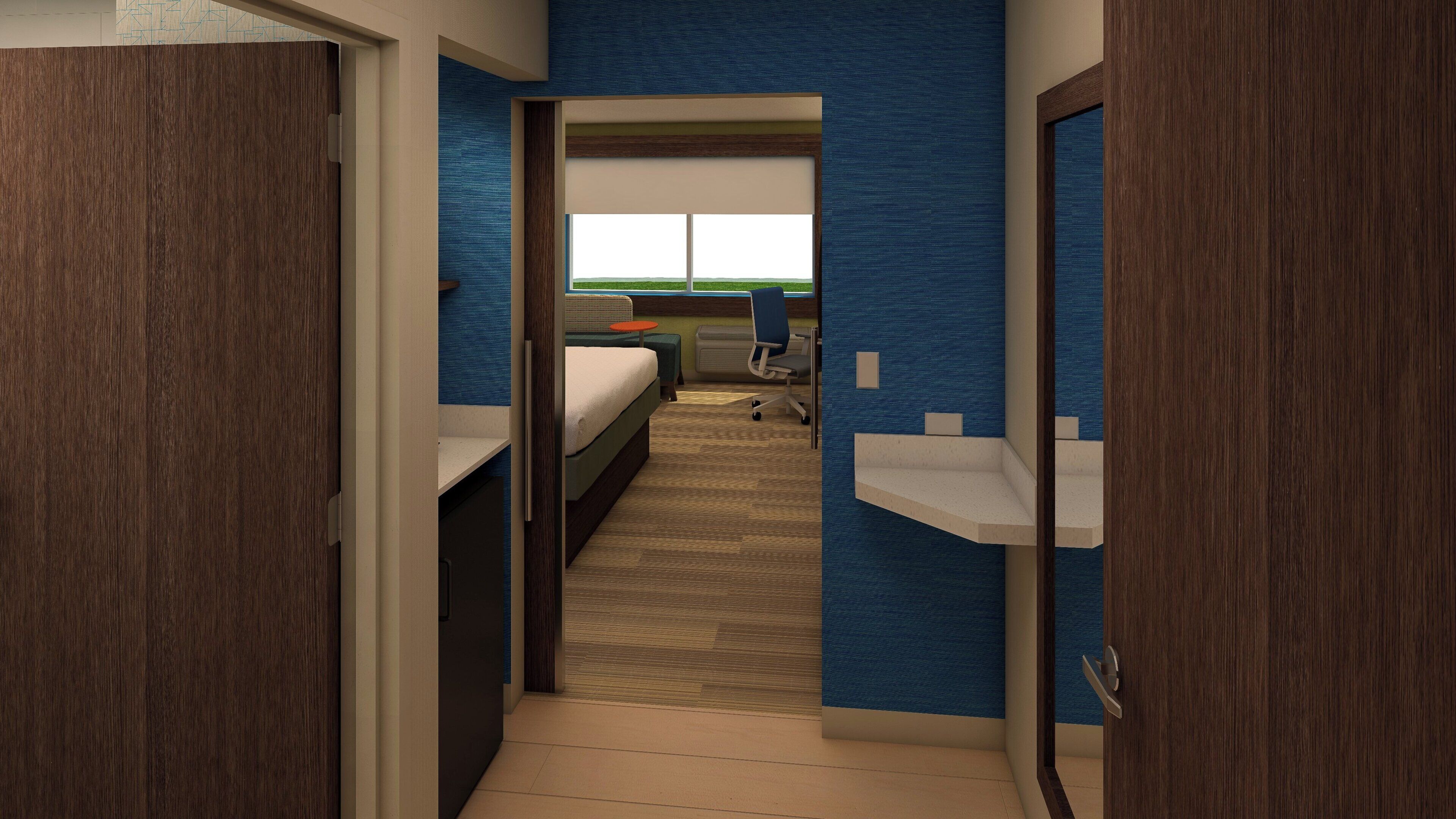 Une chambre d’hôtel avec un lit, un bureau, une chaise et une vue sur un paysage verdoyant.