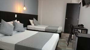 Classic Triple Room | Minibar, in-room safe, desk, laptop workspace