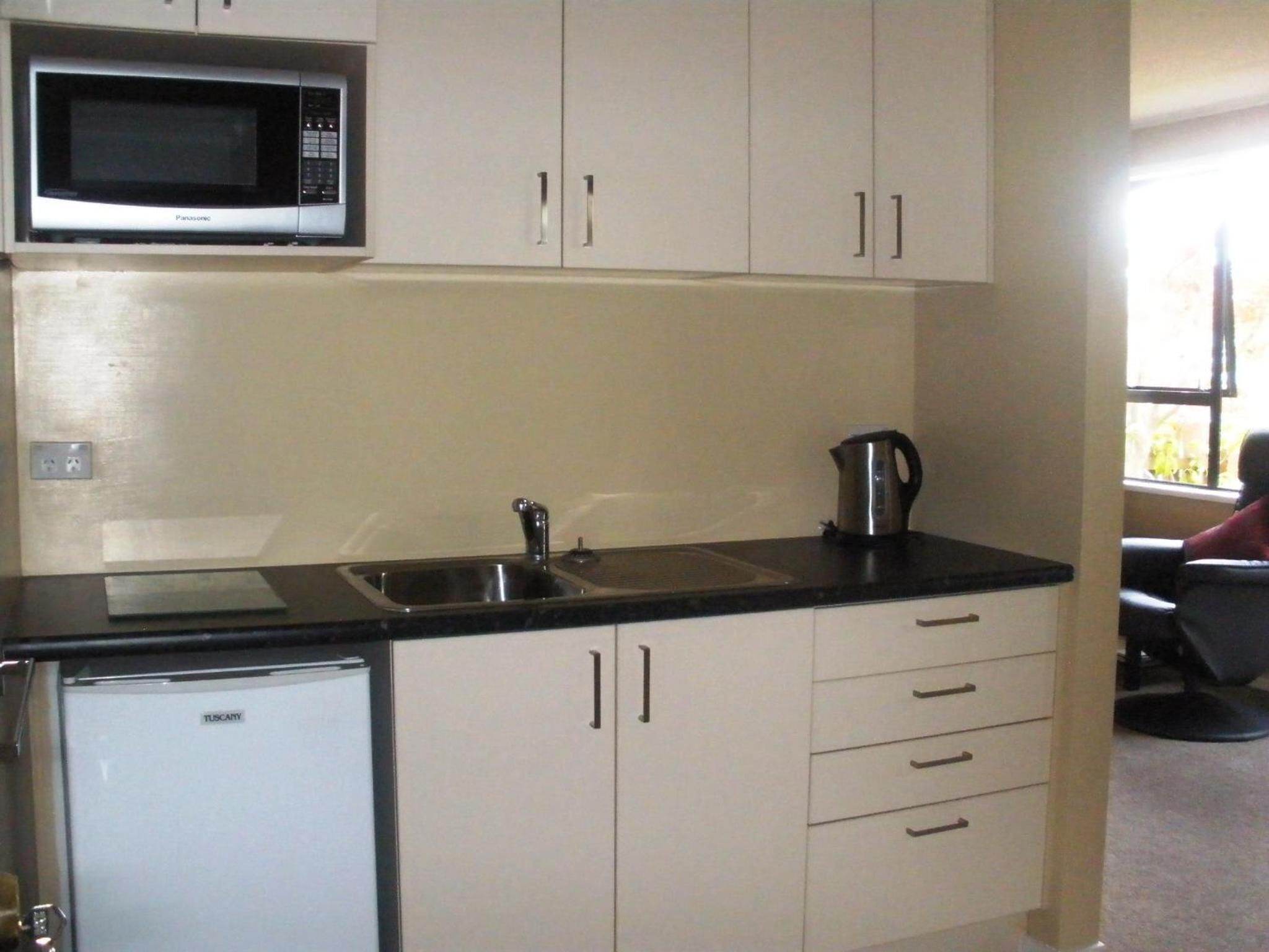 fridge, microwave, coffee/tea maker, cookware/dishes/utensils