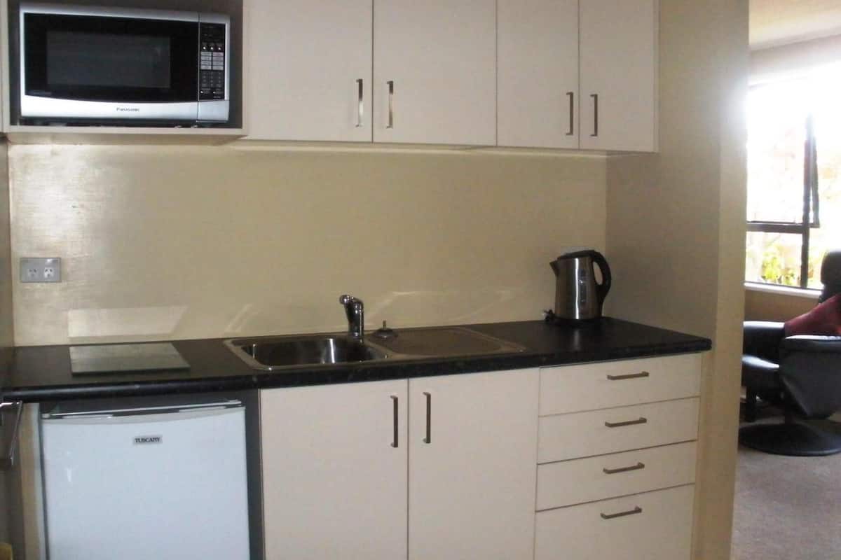 fridge, microwave, coffee/tea maker, cookware/dishes/utensils