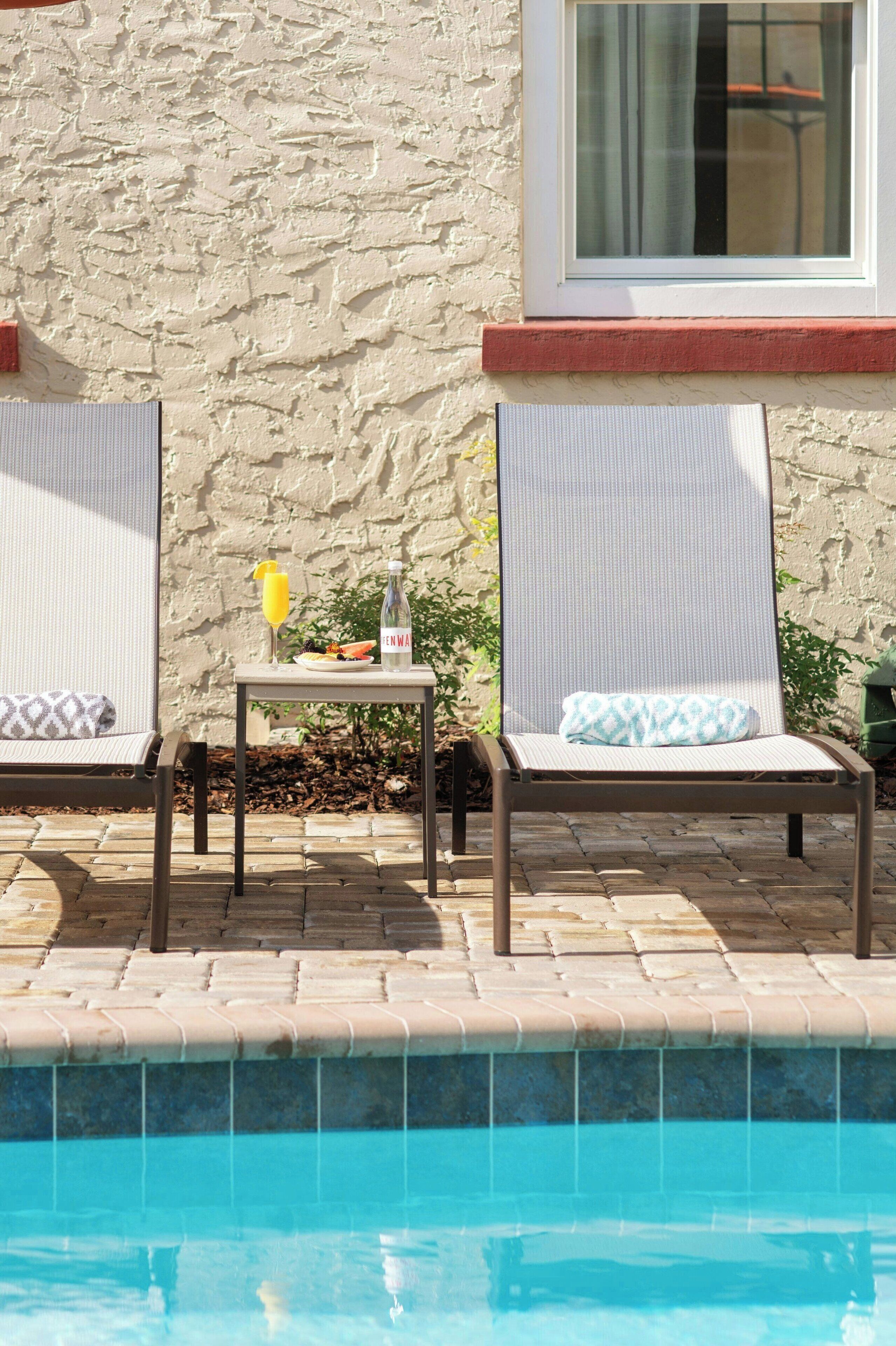 outdoor pool, pool umbrellas, pool loungers