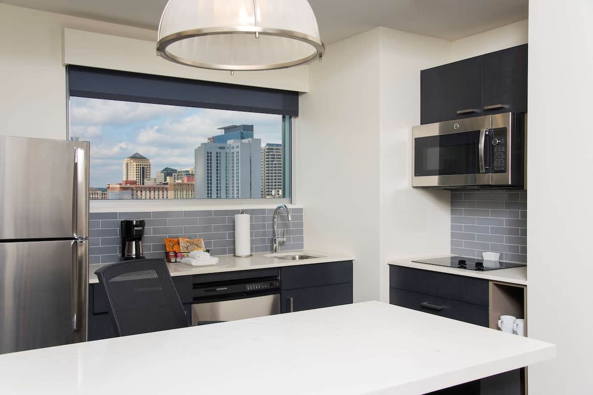 fridge, microwave, coffee/tea maker, cookware/dishes/utensils