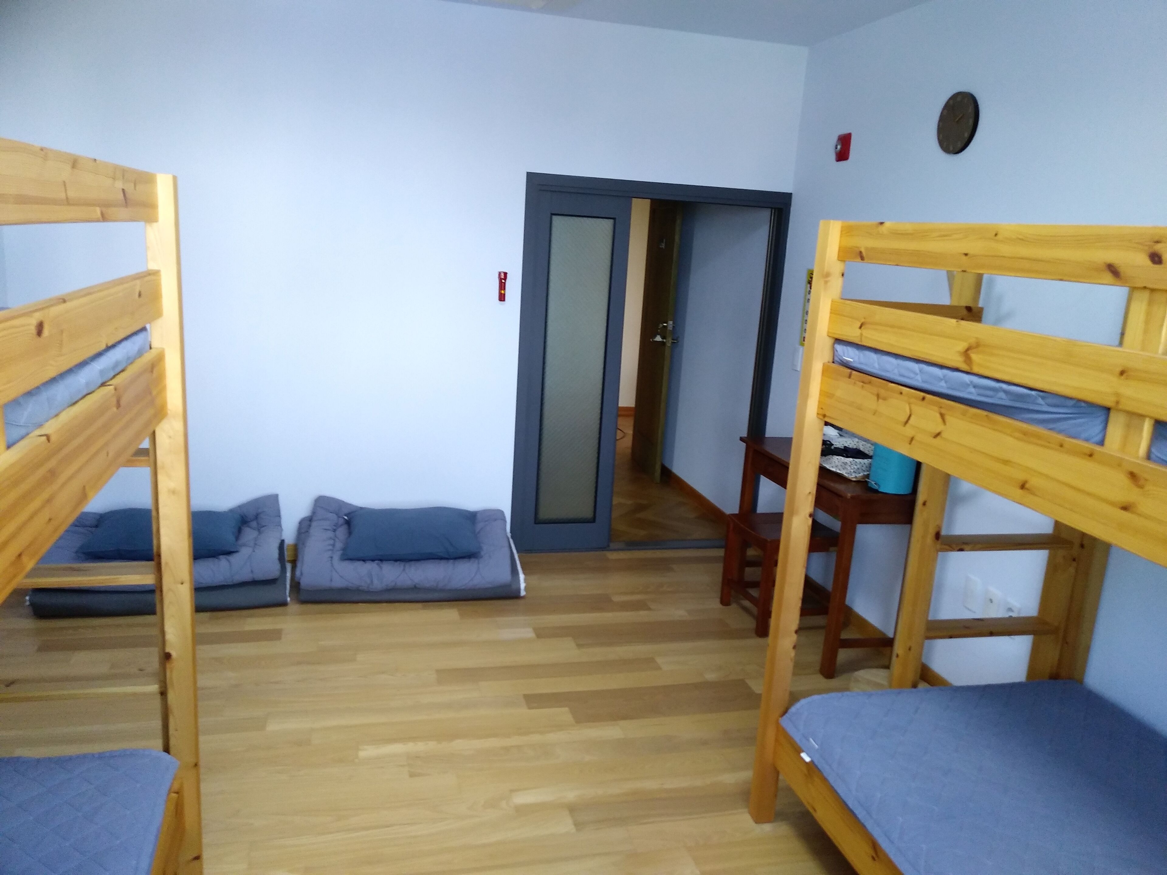 Premium bedding, desk, laptop workspace, blackout curtains