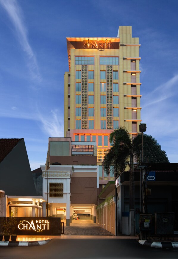 A hotel with a modern facade, multiple floors, and a prominent entrance. - Hotel Chanti (Semarang)