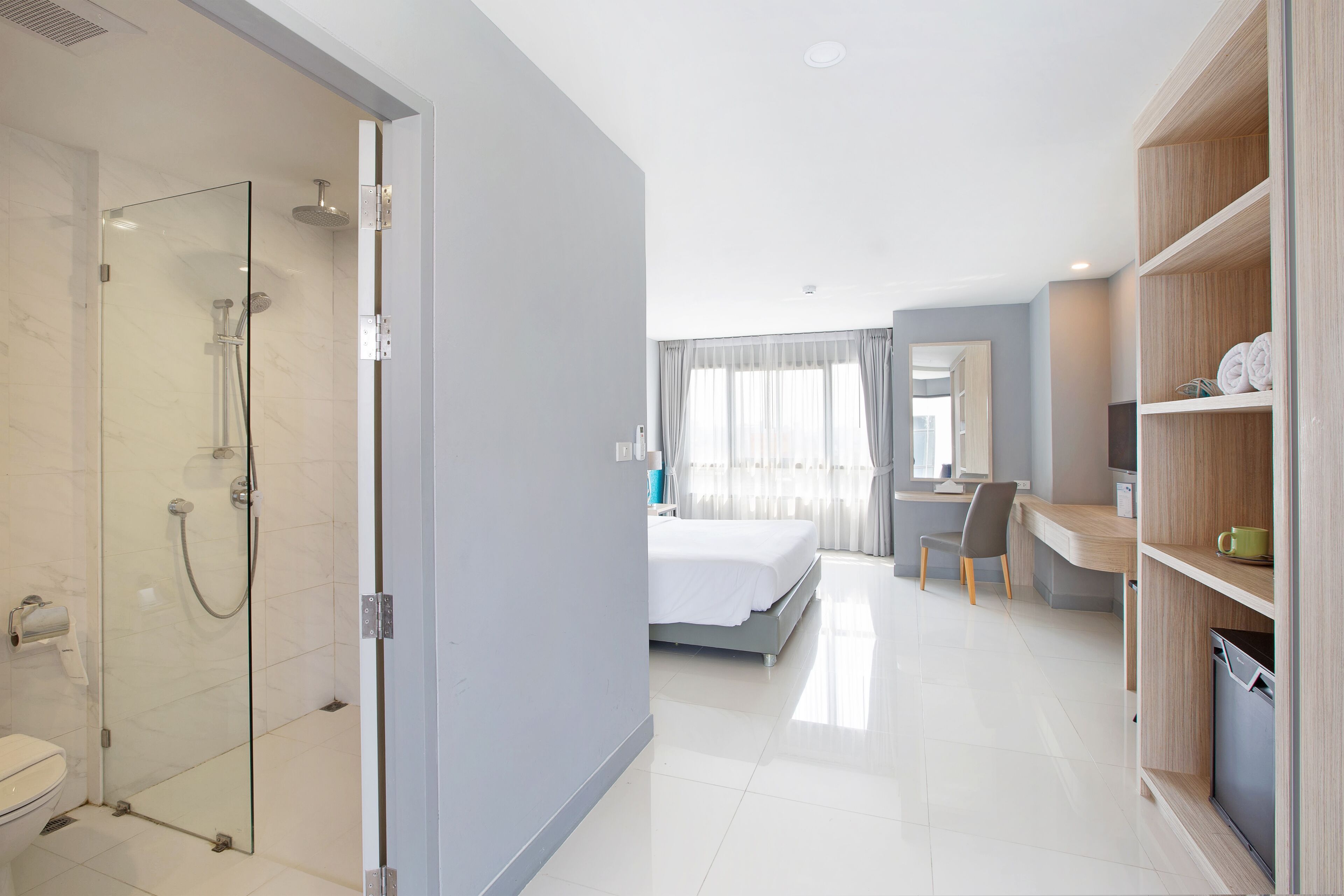 deluxe room | bathroom | shower, free toiletries, hair dryer, slippers