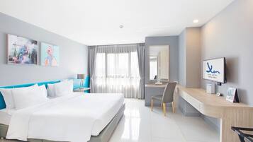 Deluxe Room | Minibar, desk, iron/ironing board, rollaway beds