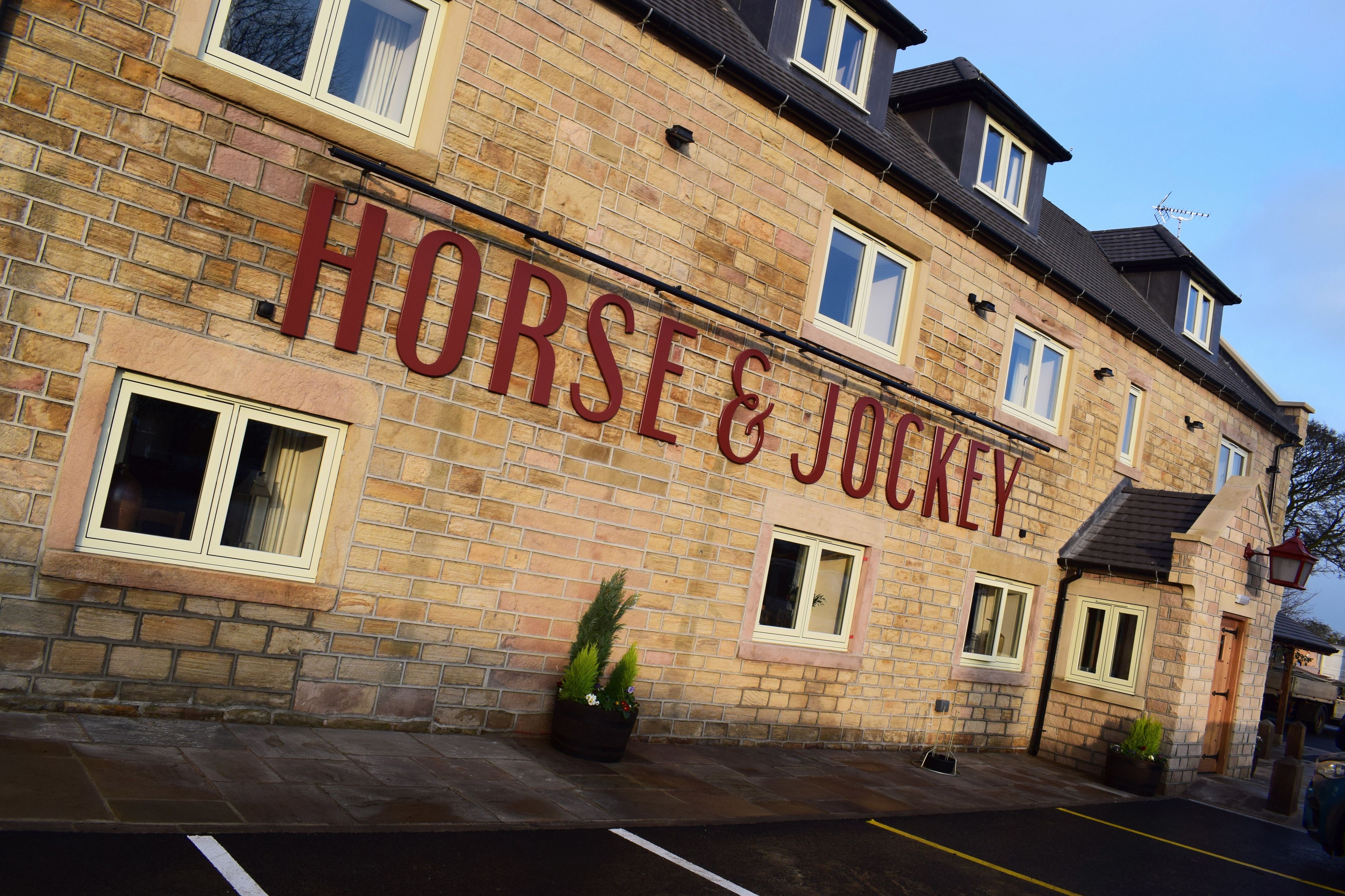 A building with a sign reading "HORSE & JOCKEY."