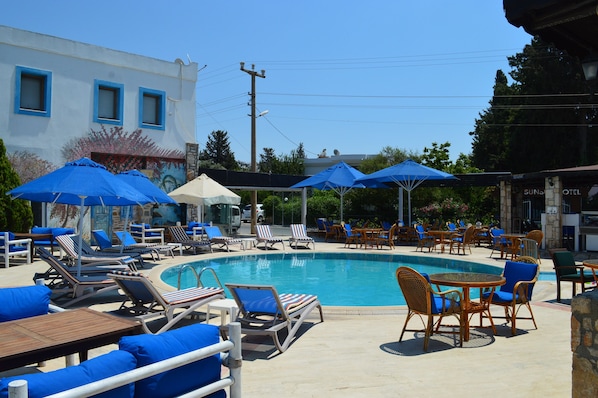 2 outdoor pools, open 8 AM to 8 PM, pool umbrellas, pool loungers