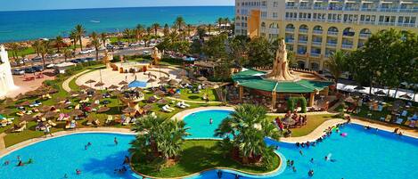 Indoor pool, outdoor pool, pool umbrellas, pool loungers