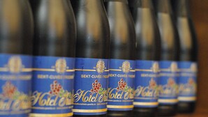 A row of bottles with labels, each featuring a logo and text. - Hotel Italia (Görlitz)
