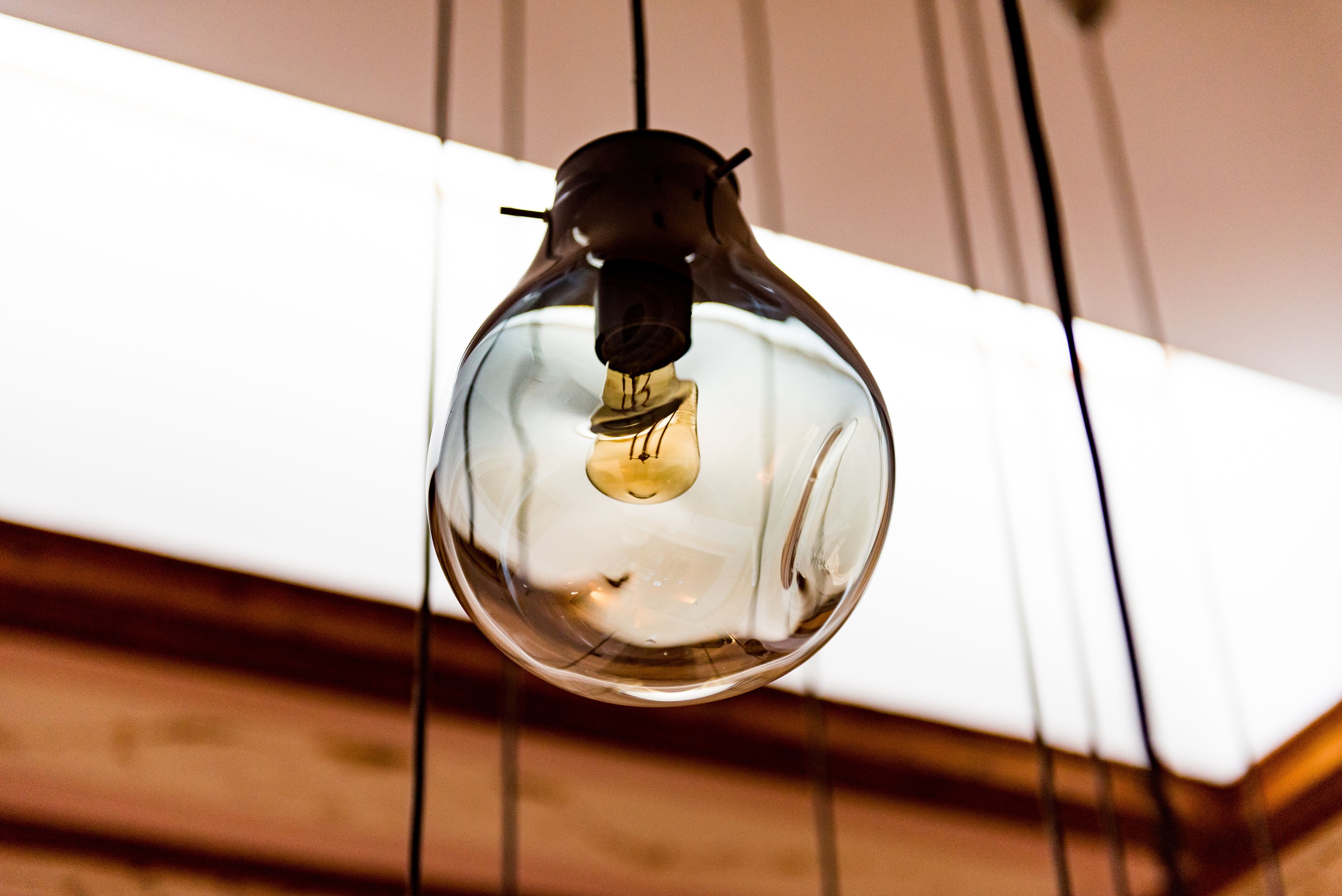 A hanging light bulb with a visible filament.