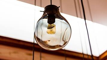 A hanging light bulb with a visible filament.