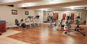 A gym with treadmills, elliptical machines, and weight equipment. - Eviston House Hotel (Killarney)