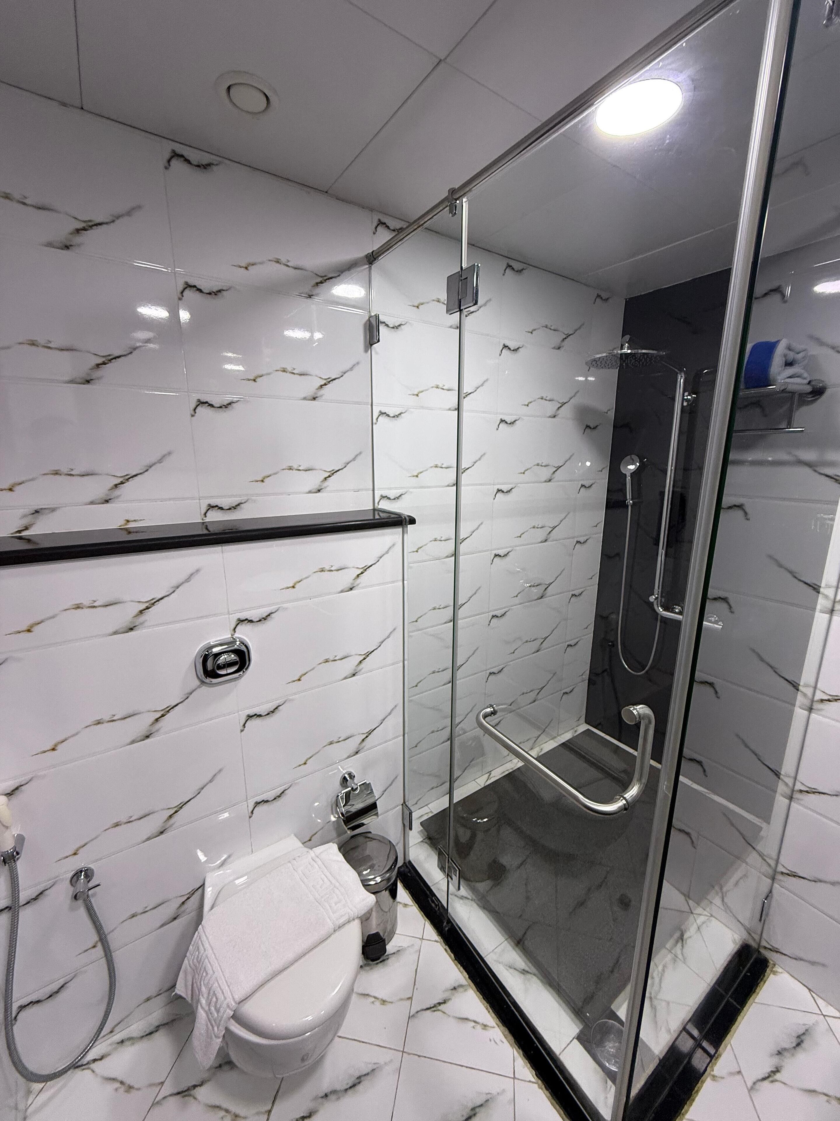 standard double room | bathroom | shower, rainfall showerhead, eco-friendly toiletries, hair dryer
