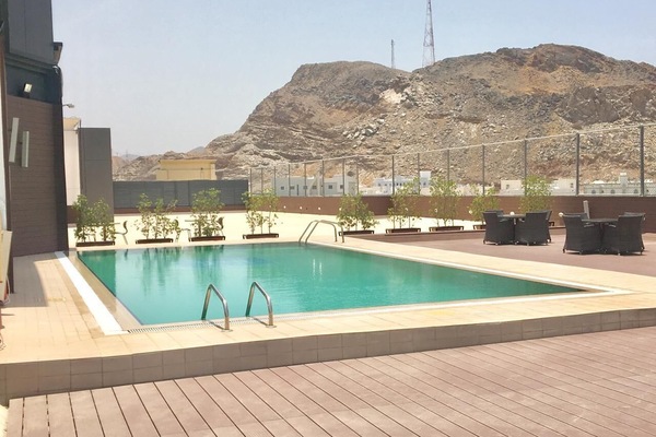 Outdoor pool, open 7:00 AM to 7:00 PM, pool loungers