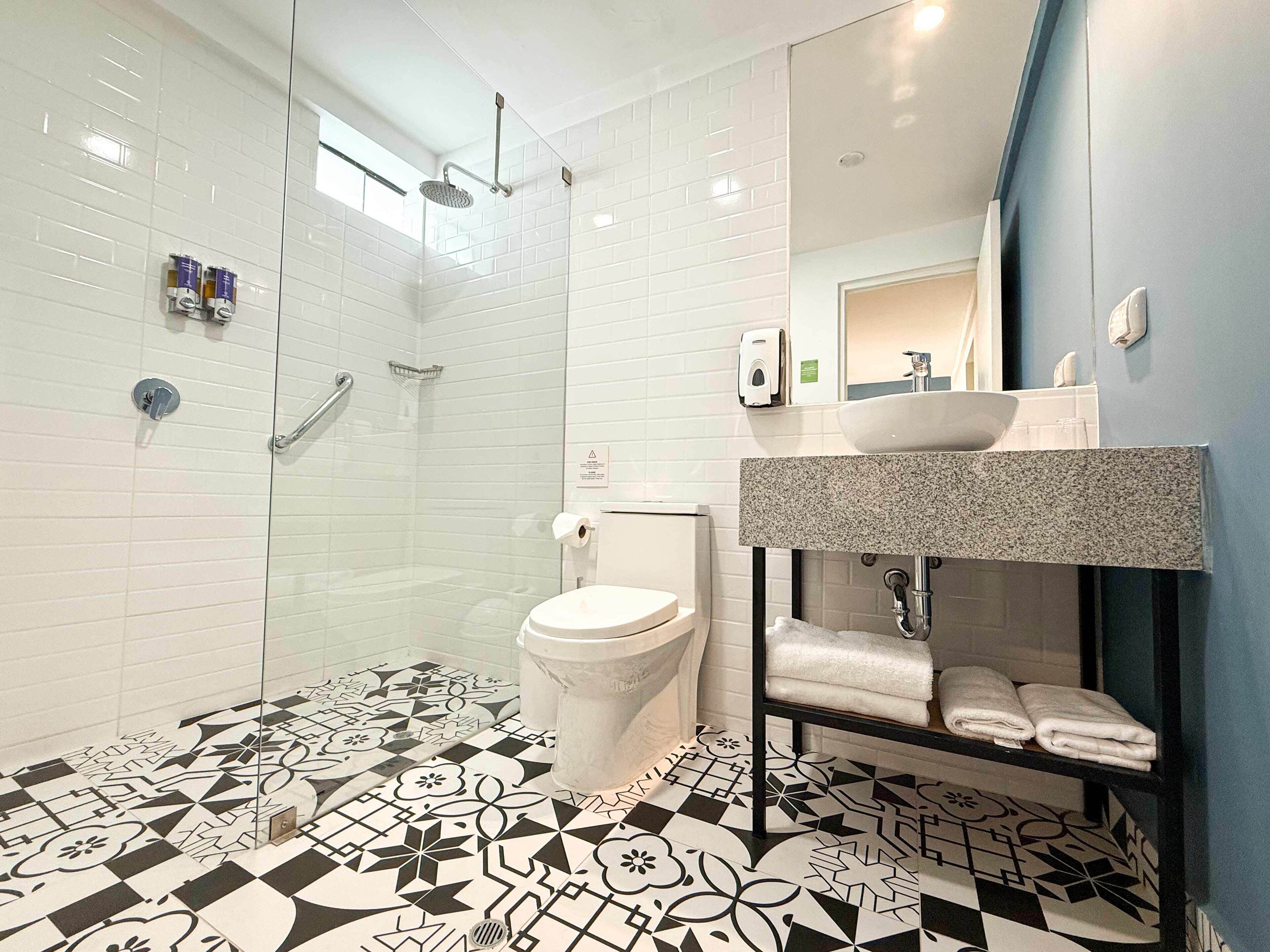 exclusive room, 1 queen bed | bathroom | shower, hair dryer, towels, soap