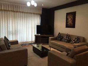 Apartment, 3 Bedrooms | Living area