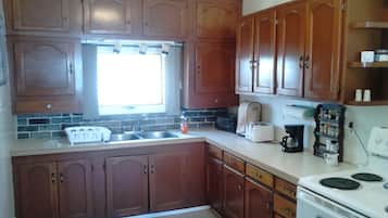 Canora Vacation Home | Private kitchen | Full-sized fridge, microwave, oven, stovetop