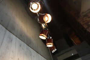 A ceiling with three pendant lights. - Star Inn Tokyo - Hostel (Tokyo)