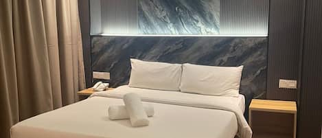 Deluxe Room, 1 King Bed | Desk, iron/ironing board, free WiFi, bed sheets
