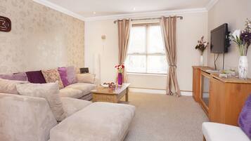Apartment, 3 Bedrooms, Patio | Living area | Flat-screen TV, DVD player