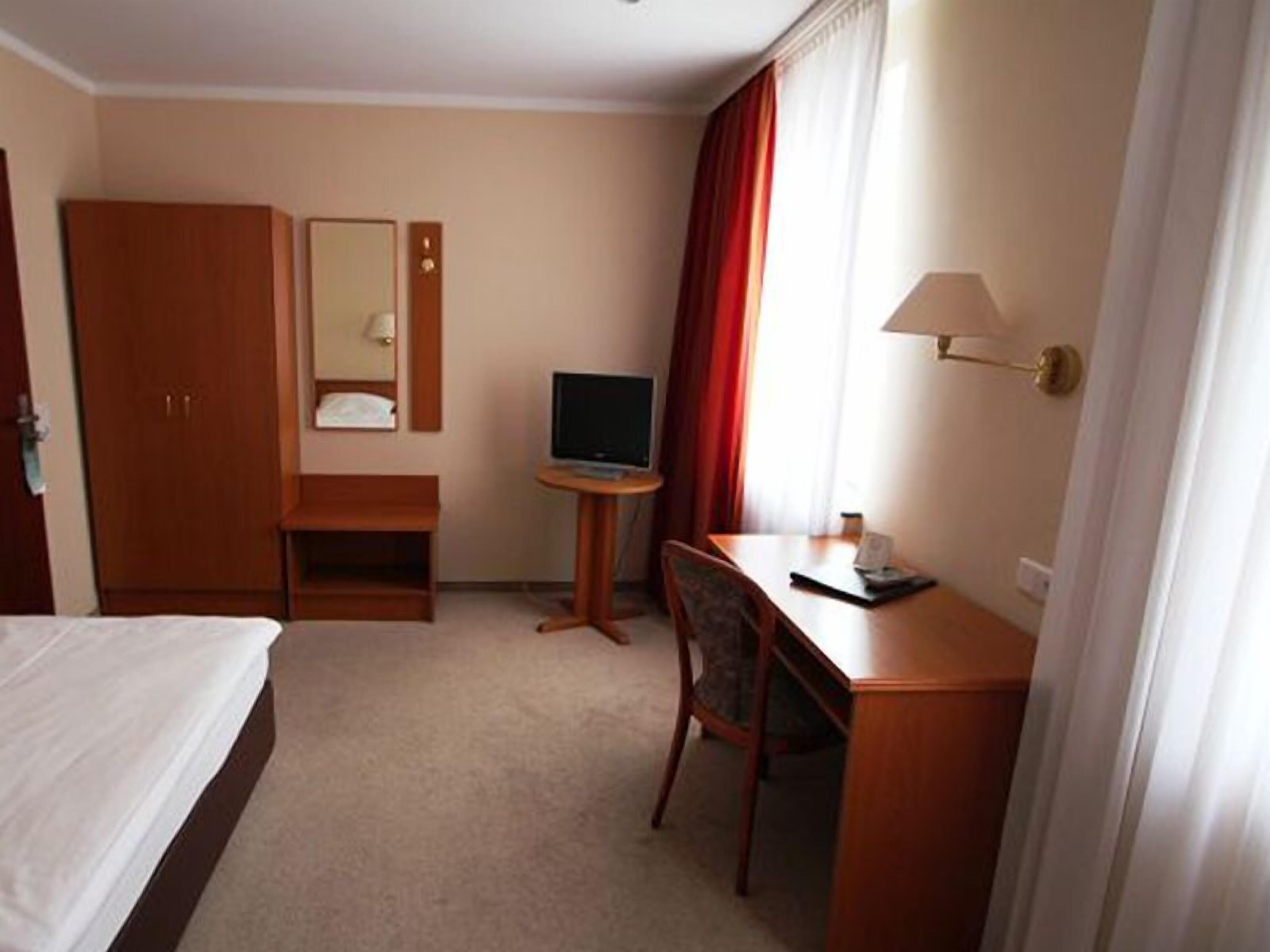 Desk, laptop workspace, blackout curtains, iron/ironing board