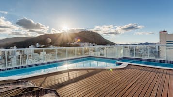 Outdoor pool, pool umbrellas, sun loungers