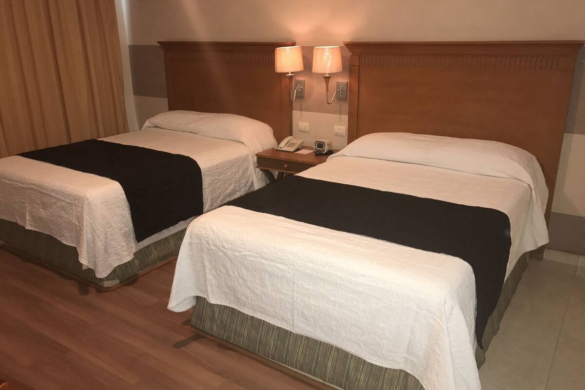 Family Double Room | Minibar, in-room safe, desk, iron/ironing board