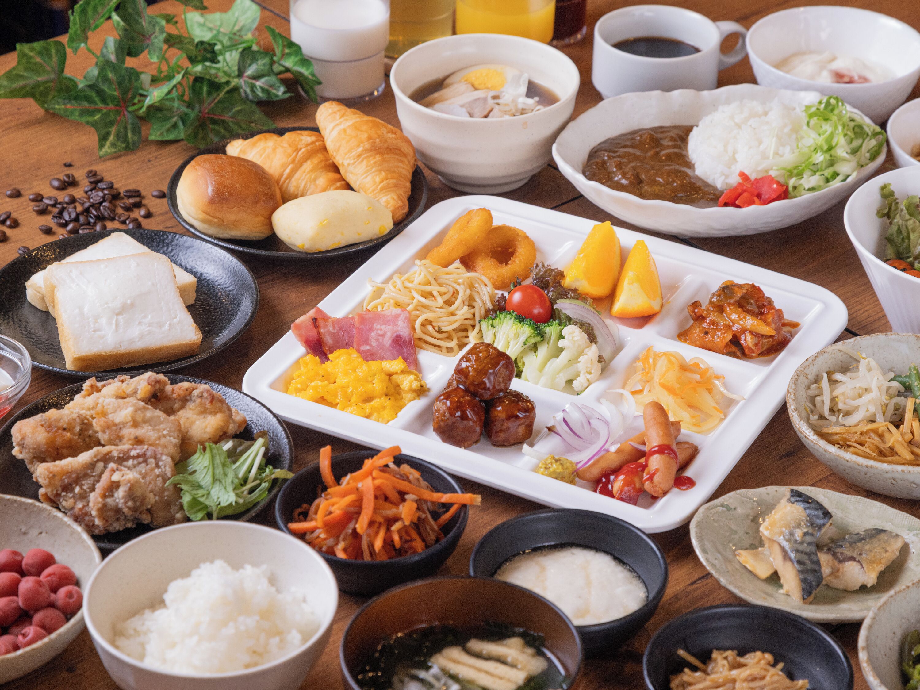 A variety of dishes including bread, rice, and vegetables, suggesting a meal setting.
