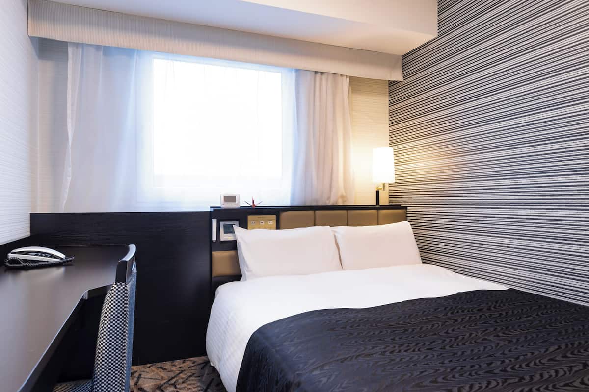 Down comforters, desk, laptop workspace, blackout drapes