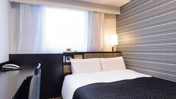 Down duvets, desk, laptop workspace, blackout curtains