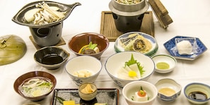 Savor traditional Japanese cuisine with an assortment of bowls and dishes featuring soups, noodles, and delicacies.