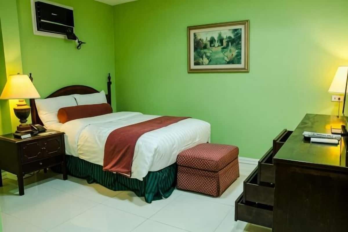 Desk, iron/ironing board, bed sheets