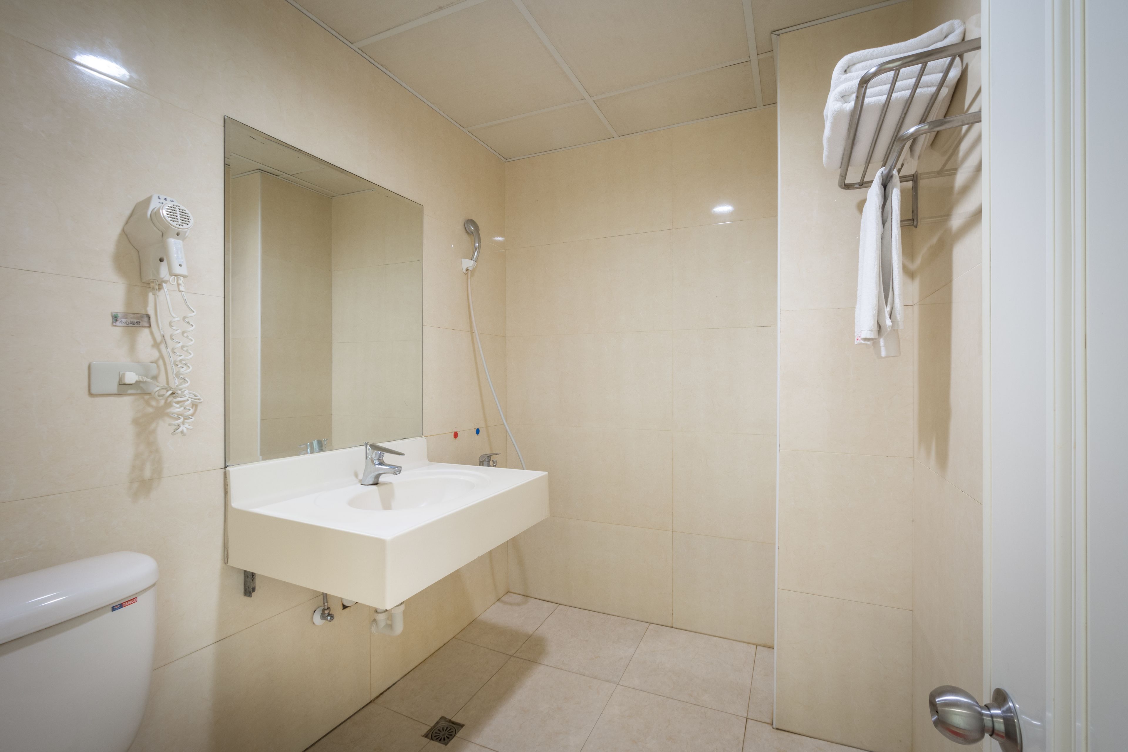 twin room | bathroom | shower, hair dryer, slippers, towels