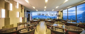 Enjoy a communal dining experience with a panoramic view of the city and mountains.