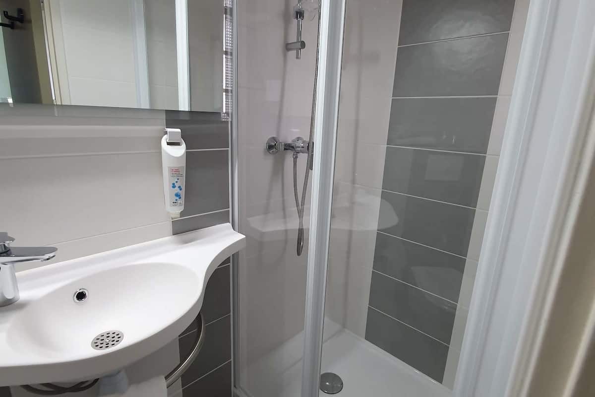 Hypo-allergenic bedding, down duvets, desk, laptop workspace