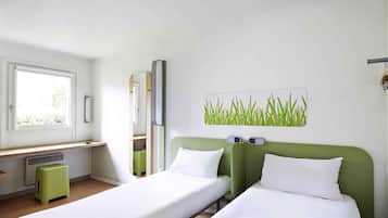Hypo-allergenic bedding, down duvets, desk, laptop workspace
