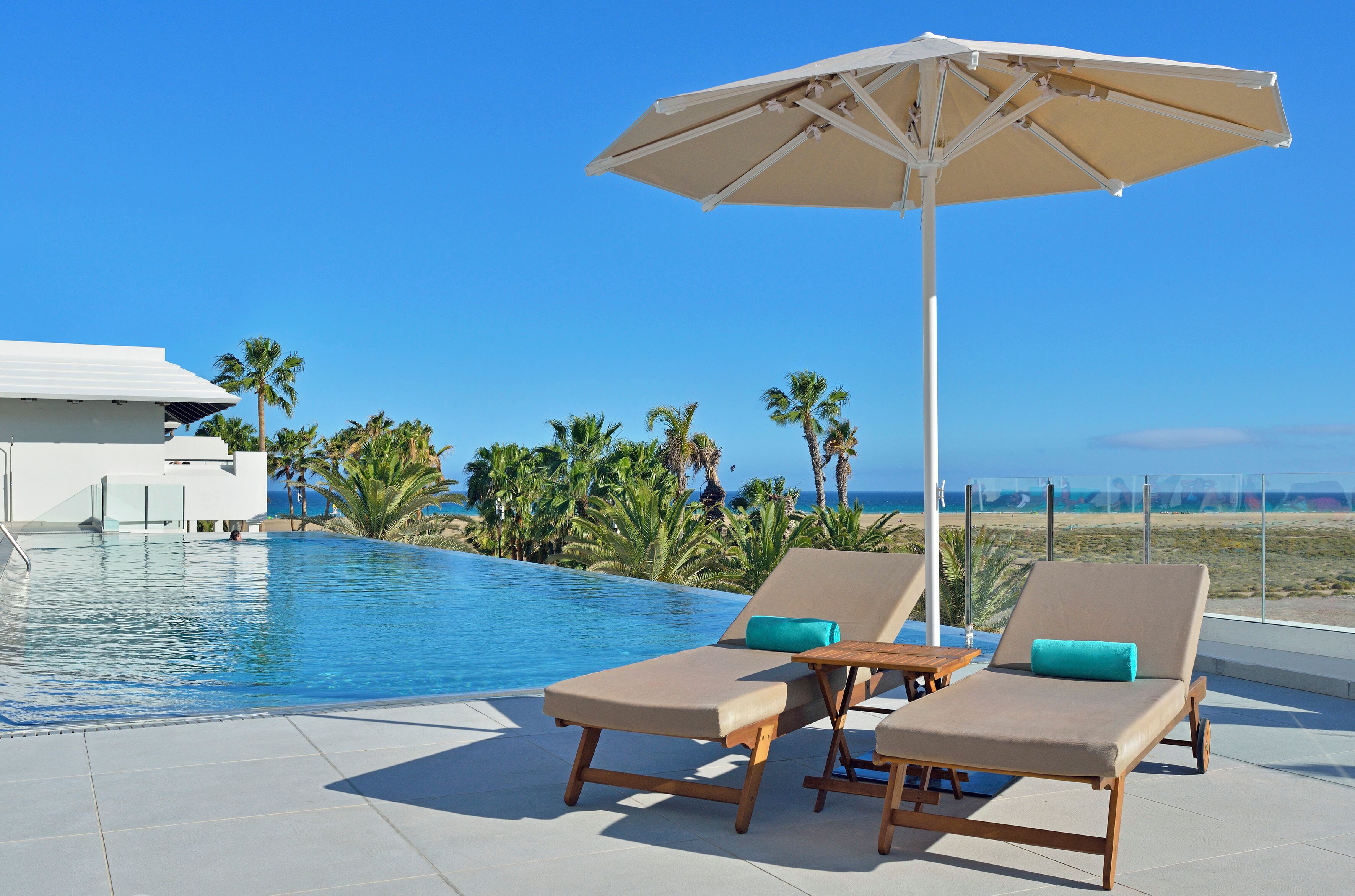 Outdoor pool, pool umbrellas, sun loungers
