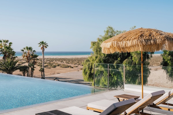 Outdoor pool, pool umbrellas, sun loungers