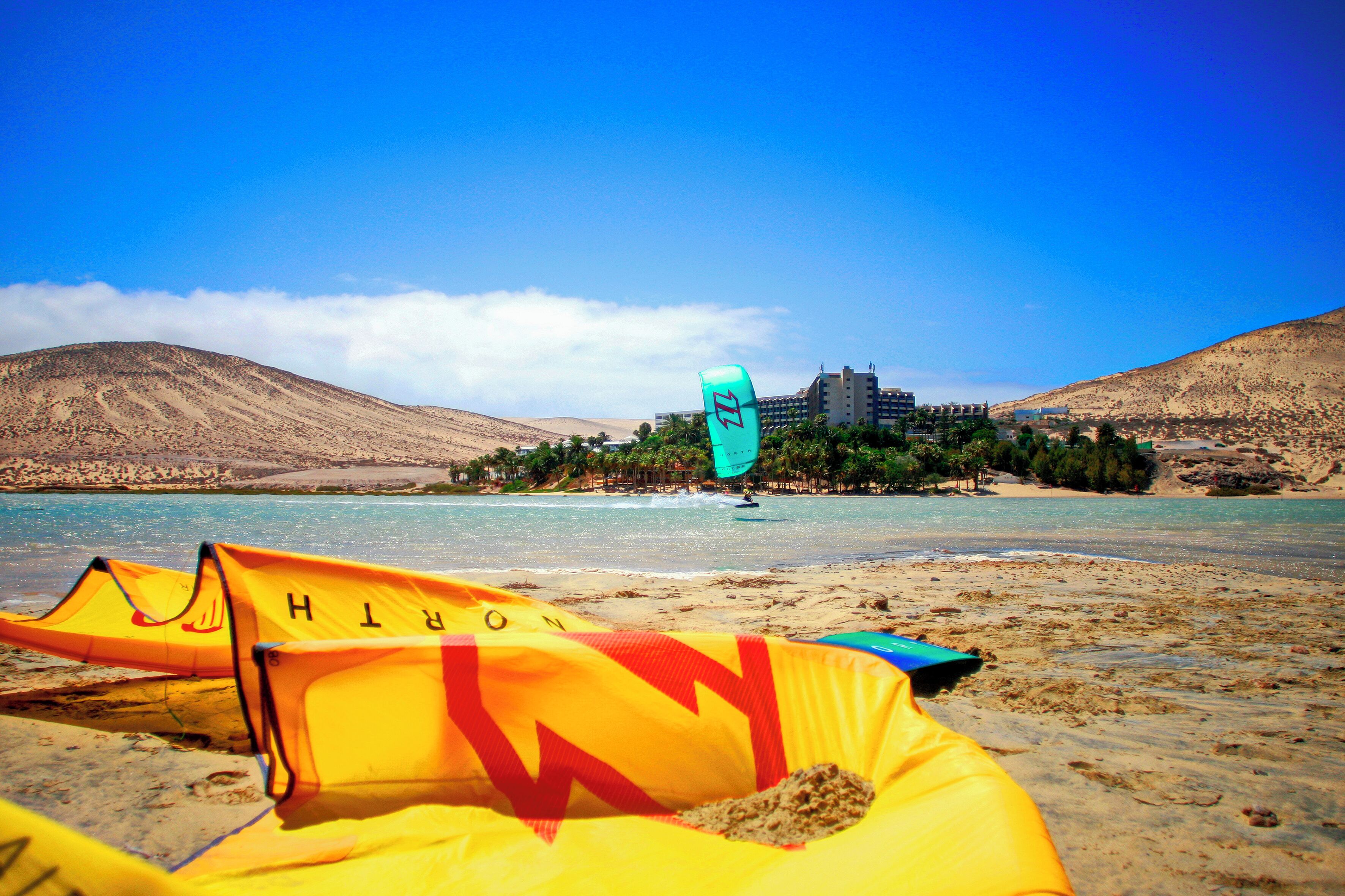 On the beach, white sand, windsurfing