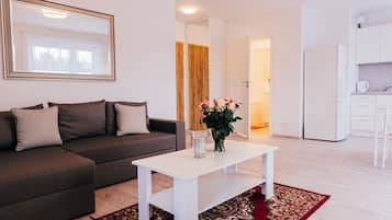 Deluxe Apartment, 1 Bedroom, Balcony (Number 19) | Living area | 40-inch flat-screen TV with cable channels, LCD TV