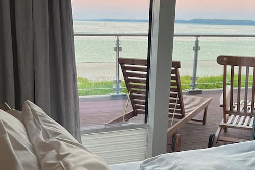 Penthouse, Sauna, Sea View | Minibar, blackout drapes, iron/ironing board, free cribs/infant beds