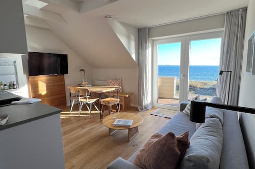 Deluxe Apartment, 2 Bedrooms, Sauna, Sea View (Dünenhaus) | Living area | Flat-screen TV