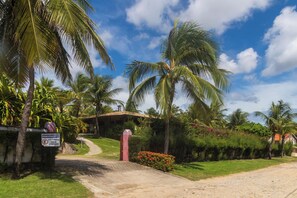 A gated entrance with a sign indicating it is an exclusive parking area for guests.